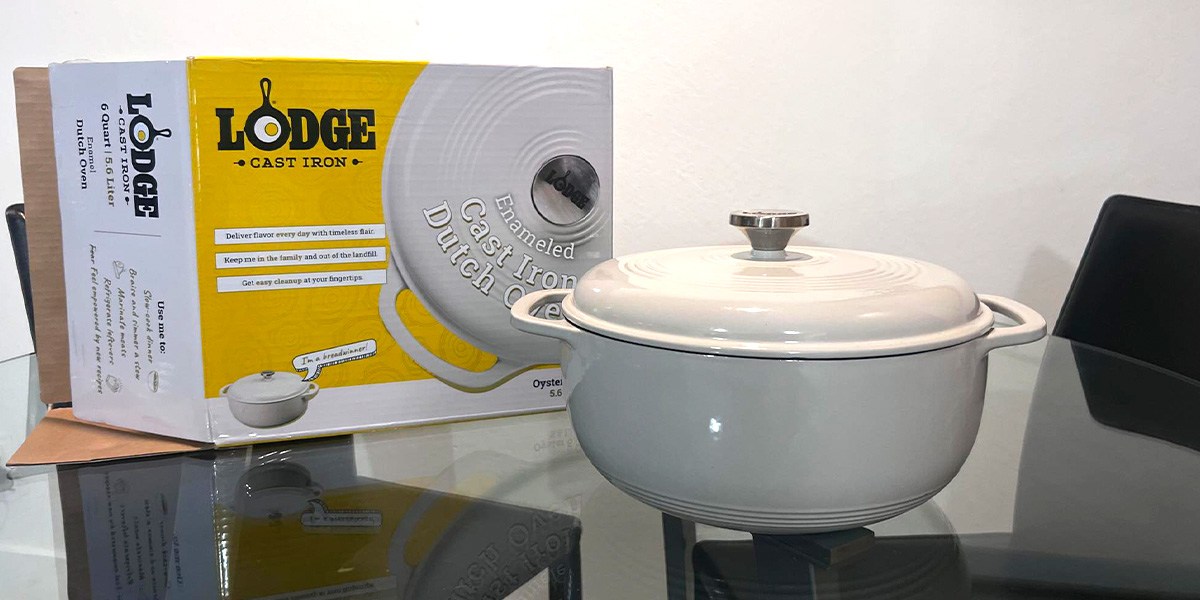 Lodge 6-Quart Enameled Cast Iron Dutch Oven next to product box Lodge 6-Quart Enameled Cast Iron Dutch Oven next to product box