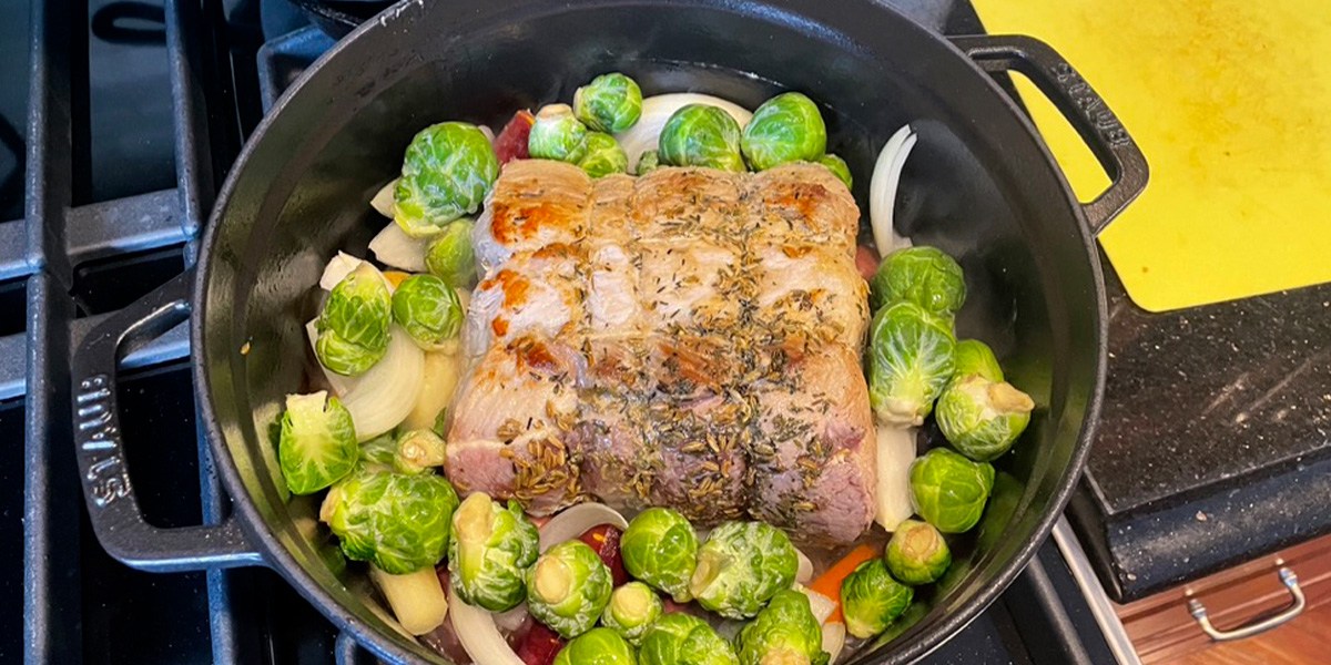 Staub Cast Iron Dutch Oven with meat and veggies inside Staub Cast Iron Dutch Oven with meat and veggies inside