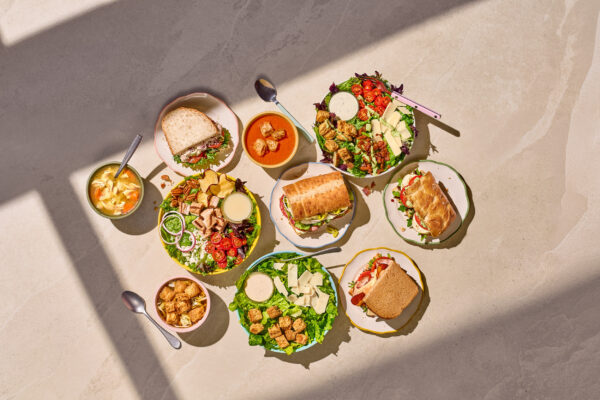 Panera sandwiches and salads on a table