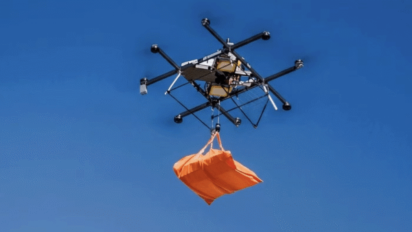 drone carrying orange takeout pizza bag
