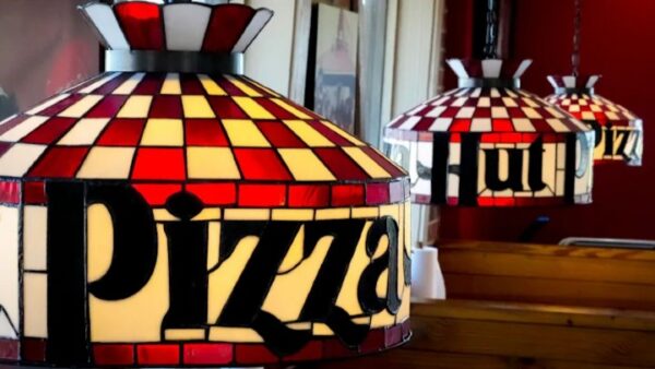Pizza Hut lamps hanging over tables at retro-style restaurant