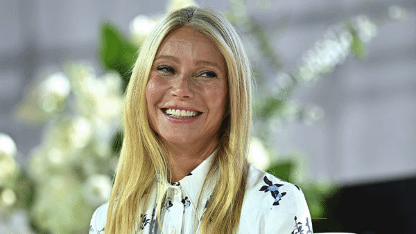 Gwyneth Paltrow in white button up shirt smiling