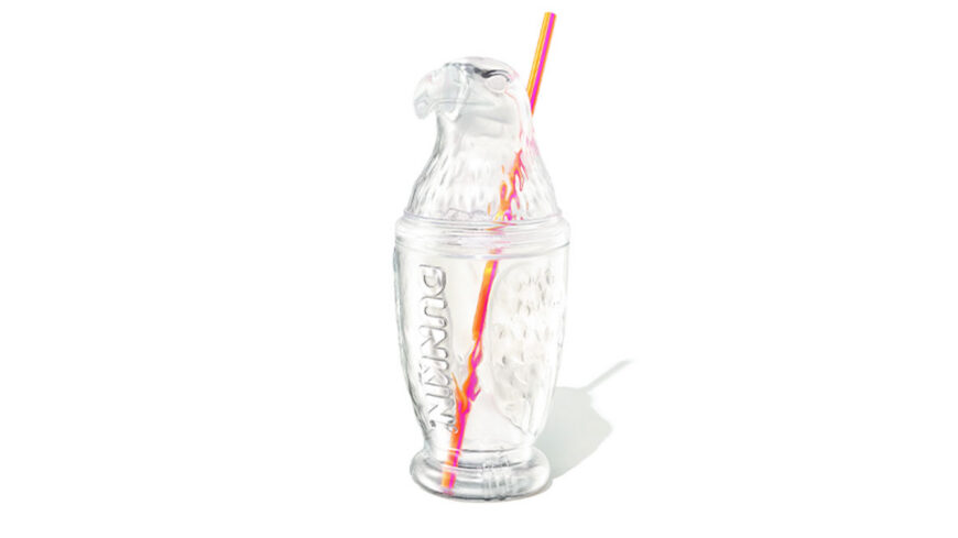 Clear plastic cup with a sculpted eagle head lid and a colorful striped straw running through the center.