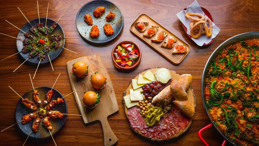The Pawn Shop specializes in Spanish tapas, offering dishes such as pickled vegetables, pan con tomate, churros and more. 