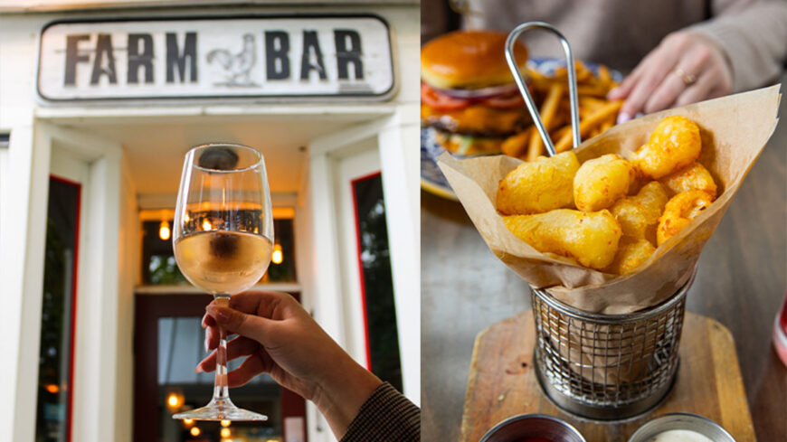 Glass of wine in front of Farm Bar sign