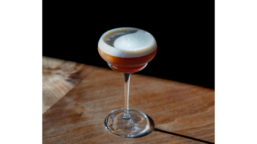 Martini on bar with foam on top