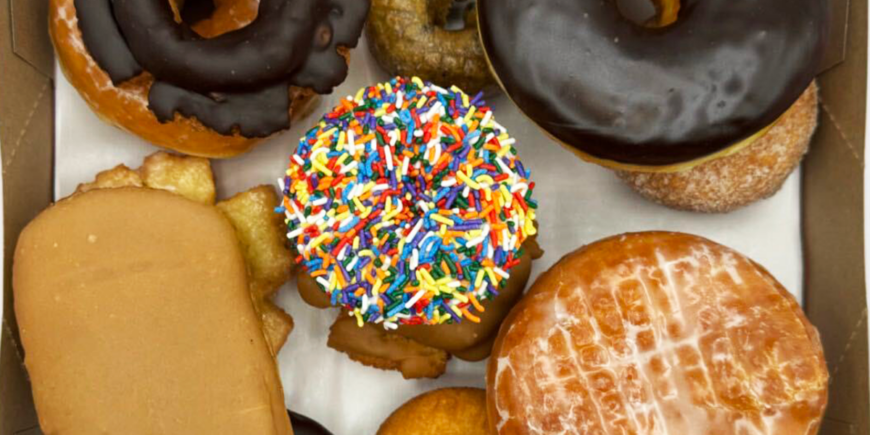 Box of mixed sprinkle, glazed and maple bar doughnuts
