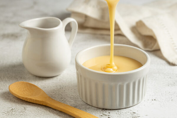 Fresh condensed milk in the bowl.