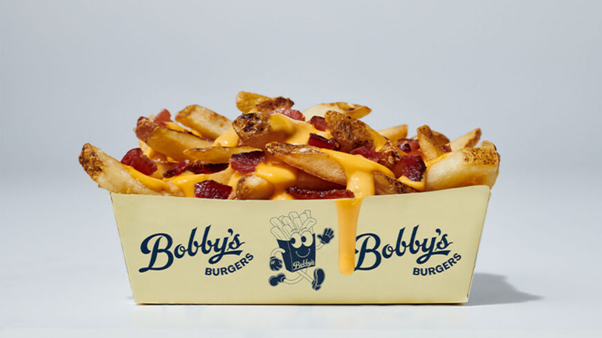 A tray of loaded French fries topped with melted cheese sauce and bacon pieces in branded Bobby's Burgers packaging against a light gray background.