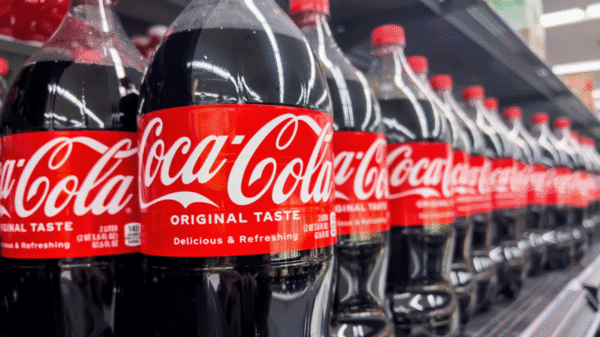 Coca Cola bottles on shelves