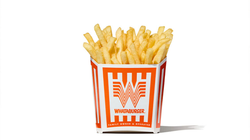 A carton of golden French fries in a branded Whataburger container against a plain white background.