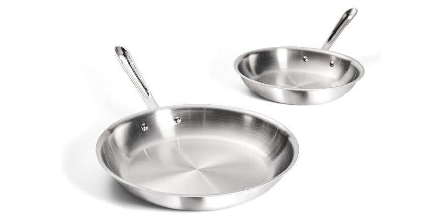 two stainless steel pans of different sizes on a white background