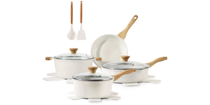 a set of four white pots and pans with light wood handles and two spatulas on a white background