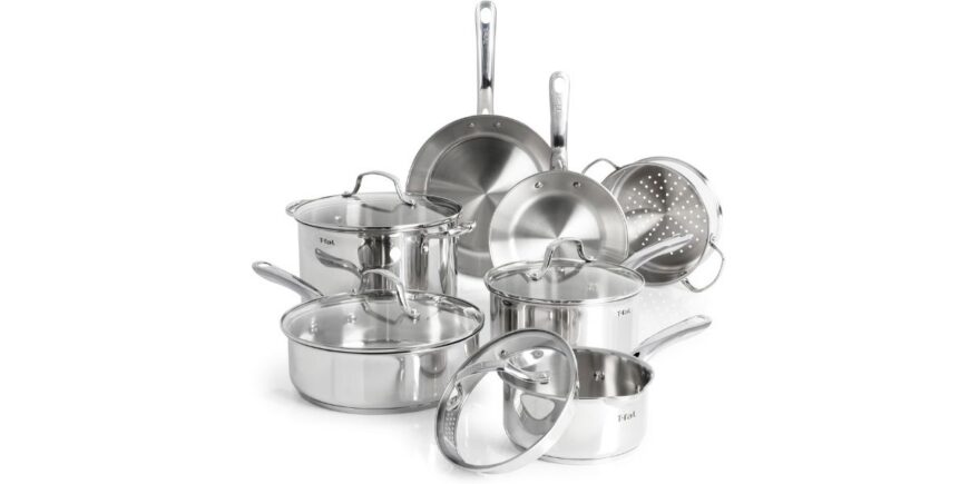 a set of six stainless steel pots and pans with lids on a white background