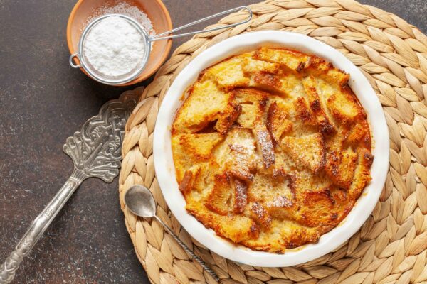 Homemade easy sweet dessert. Bread pudding in baking pan