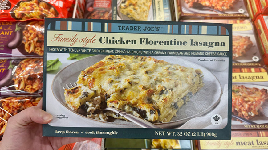 Trader Joe’s Family Style Chicken Florentine Lasagna in a 32-ounce box, showing a baked lasagna made with chicken, spinach, onions, and a creamy Parmesan and Romano cheese sauce.