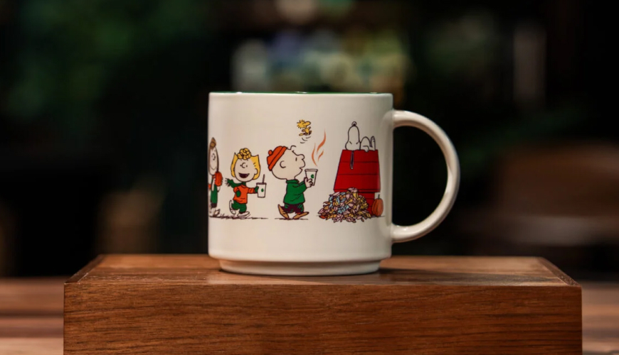 White ceramic mug with Peanuts characters on it
