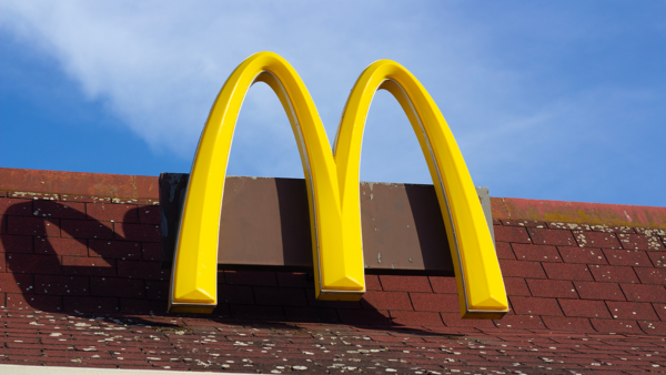 McDonald's golden arches sign on building