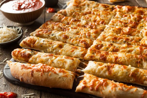 Homemade Cheesy Breadsticks with Marinara Sauce for Dipping
