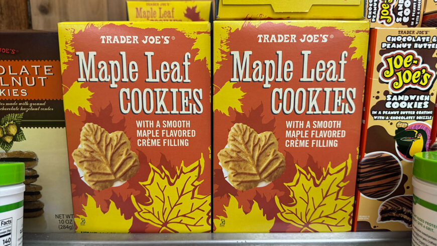 Two boxes of Trader Joe’s Maple Leaf Cookies displayed on a store shelf, featuring maple-leaf-shaped cookies with maple-flavored crème filling.