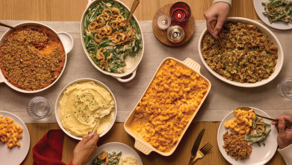 Thanksgiving table showing various side dishes