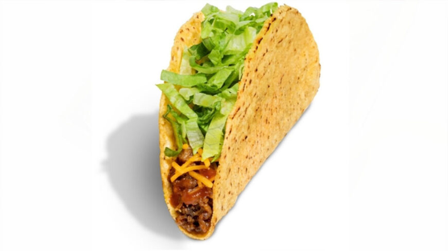 A crispy hard-shell taco filled with seasoned ground beef, shredded cheddar cheese, and shredded lettuce.