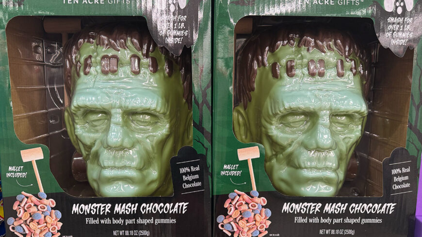 Boxes of Monster Mash chocolate featuring a green Frankenstein-shaped Belgian chocolate head filled with body-part-shaped gummies.