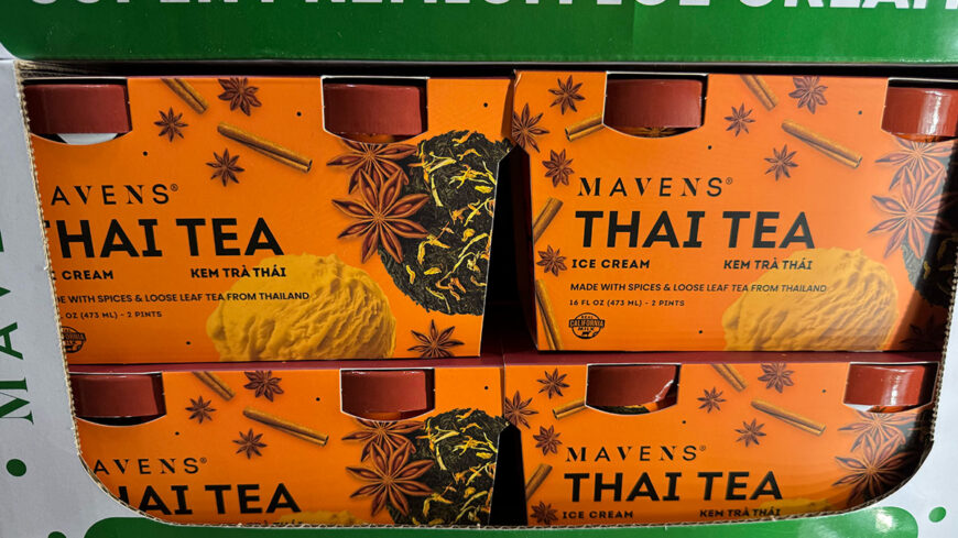 Display box of Mavens Thai Tea ice cream, featuring an orange package decorated with star anise, cinnamon sticks, and loose-leaf tea.